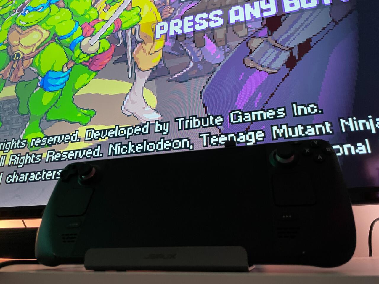 You shouldn't have to change any Deck settings for it to output to your TV. You just plug it in.