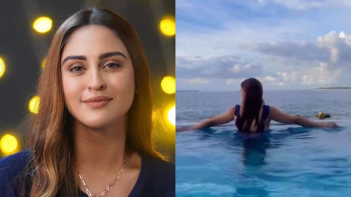 Krystle D’souza looks smoldering HOT in blue swimsuit as she takes a dip in infinity pool | WATCH