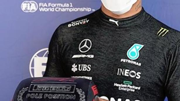 Hamilton claims his 100th pole