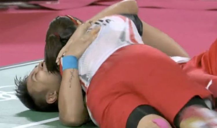 Jubilant Indonesian badminton pair collapse to floor in joy as they steal gold from China
