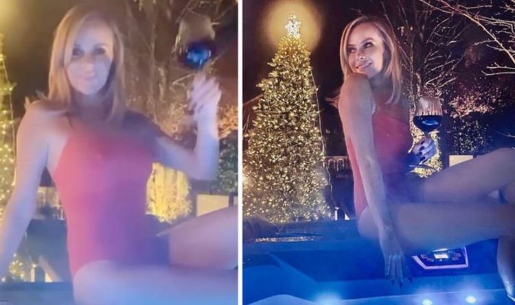 Amanda Holden smoulders as she strips to swimsuit for hot tub session