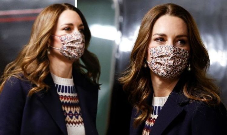 Kate Middleton recycles navy coat with festive jumper arriving in Manchester with William