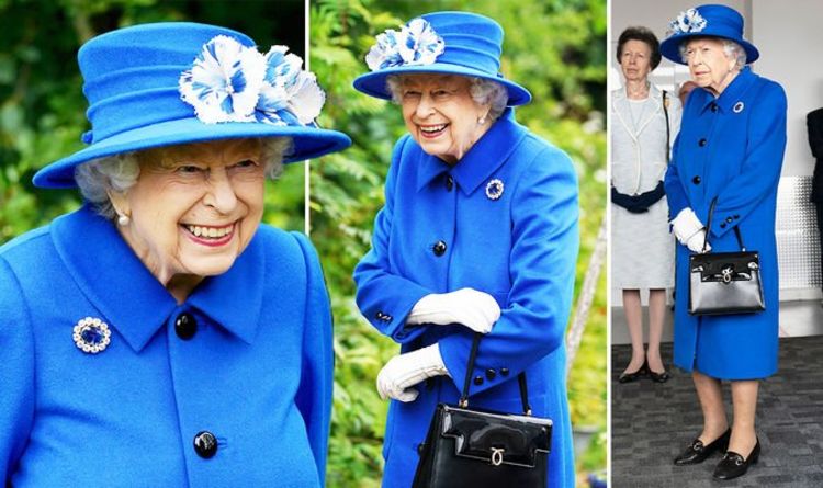 Queen looks regal in bold blue coat and historical sapphire brooch today in Scotland