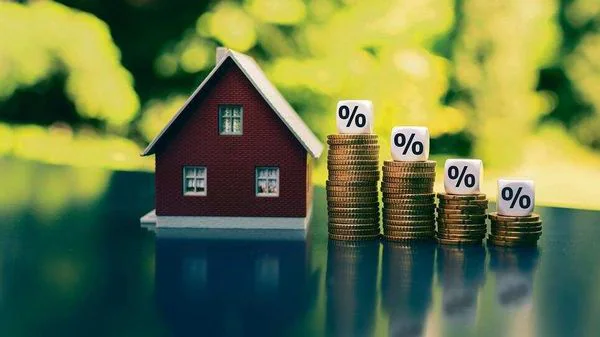 Know how NRIs can reduce tax deducted at source while selling property in India