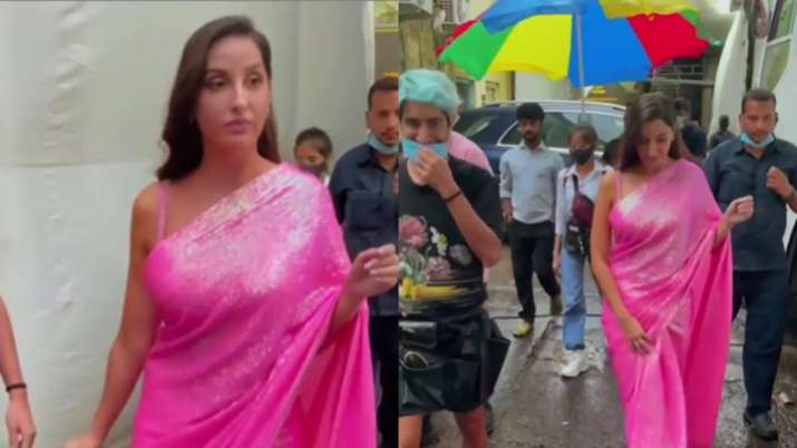 Nora Fatehi walks around in pink saree amid Mumbai rains; Netizen troll her and ask 'mask kahan hain?'