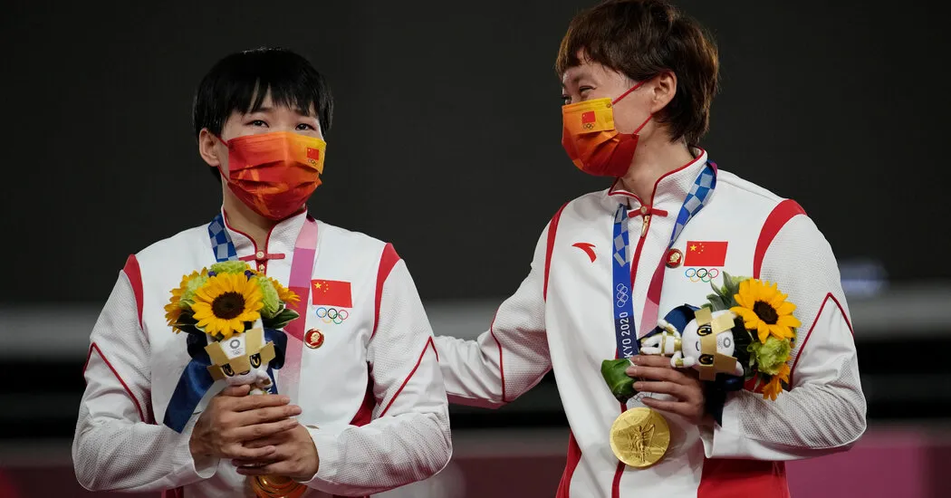 I.O.C. seeks answers after two Chinese athletes wore Mao pins during the medal ceremony.