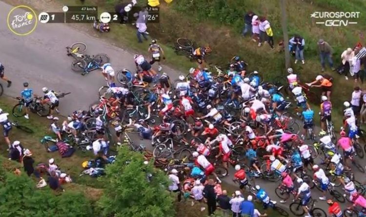 Tour de France crash: Fan causes huge pile up in peloton as Tony Martin collides with sign