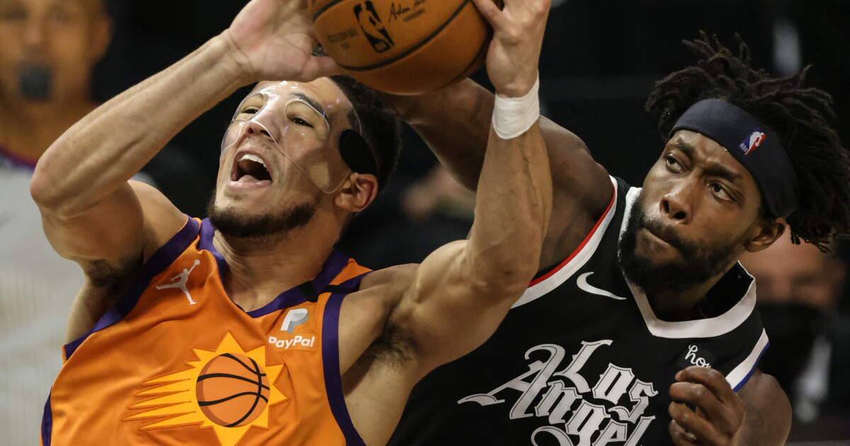 Commentary: Clippers slow down Devin Booker, who says mask is not the problem