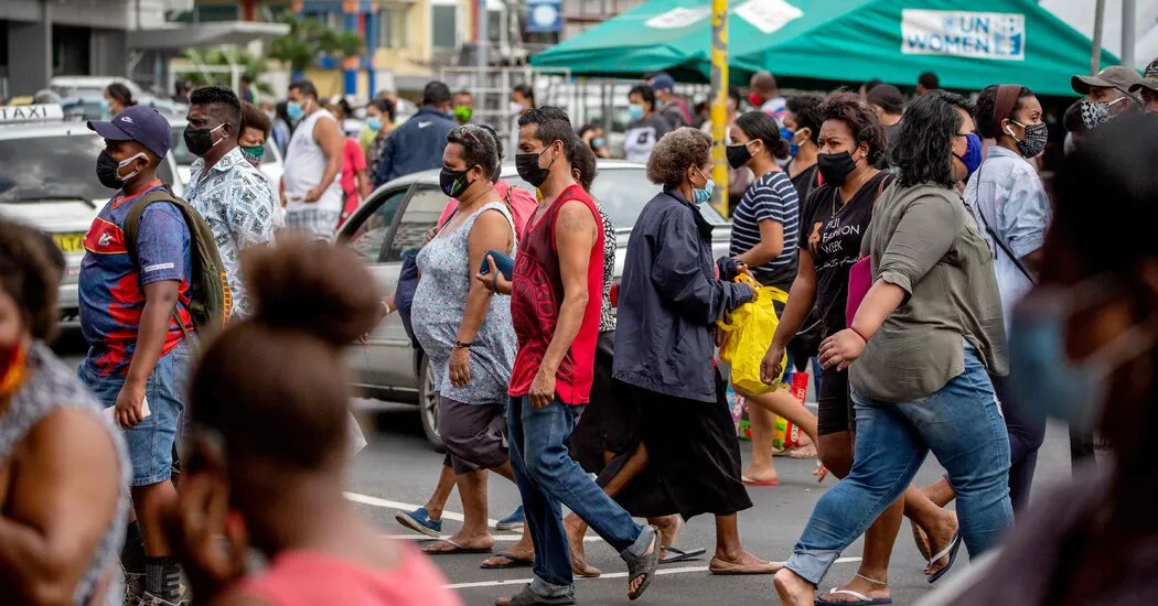As a Covid outbreak worsens, Fiji’s Olympic athletes fly to Japan on a plane full of fish.
