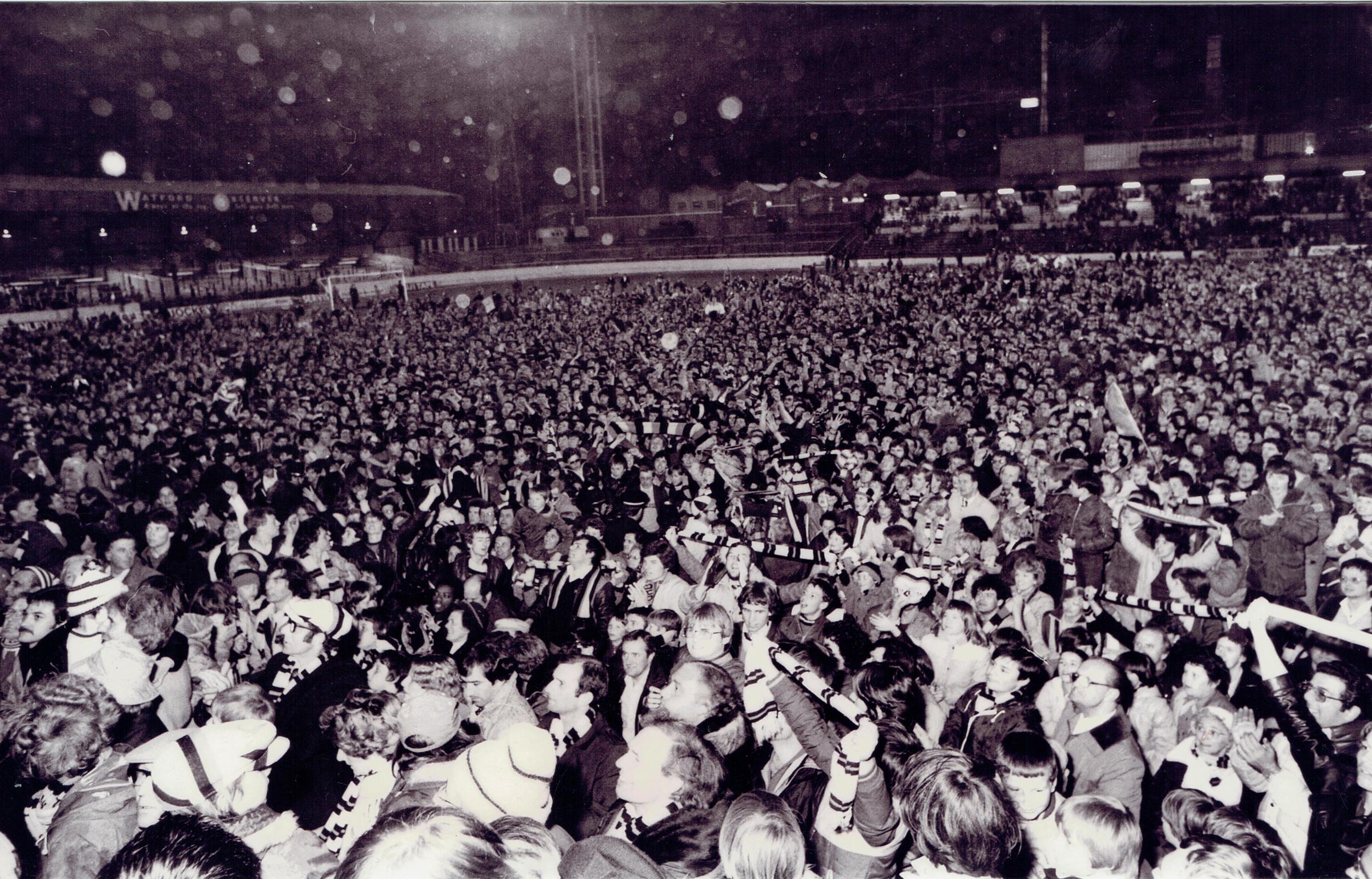 Thousands of celebrating fans invaded the Vicarage Road pitch